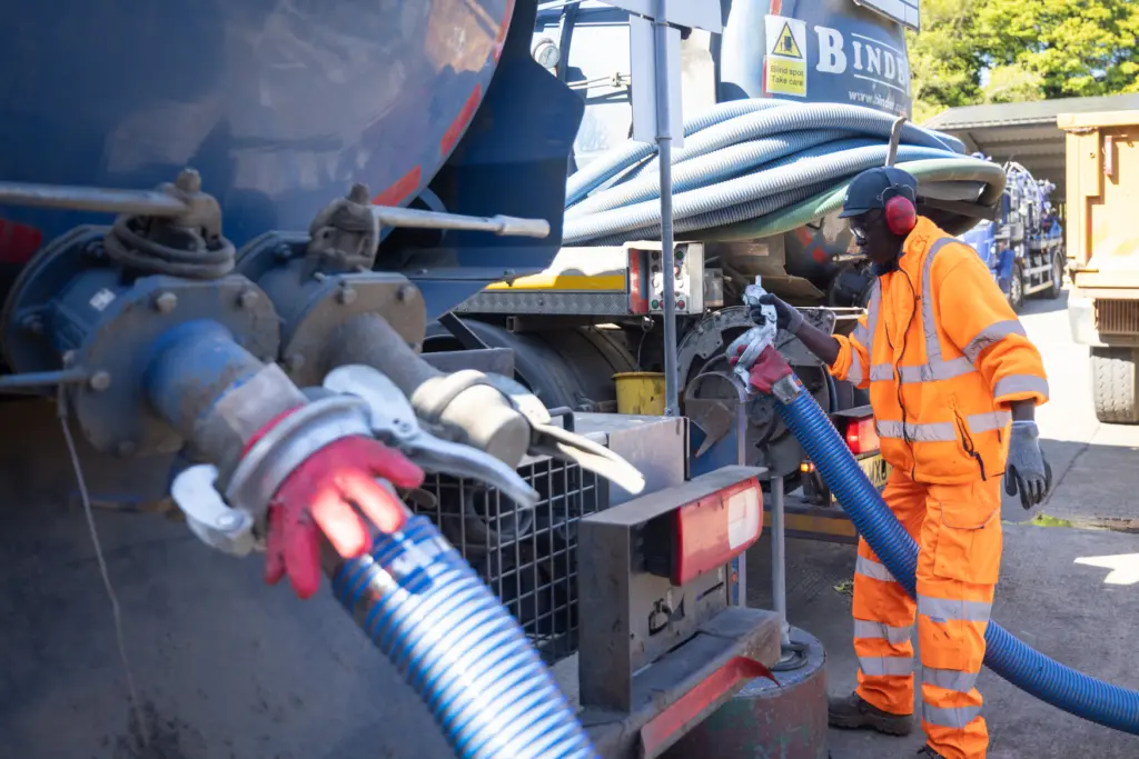 Emptying tanker on site with PPE