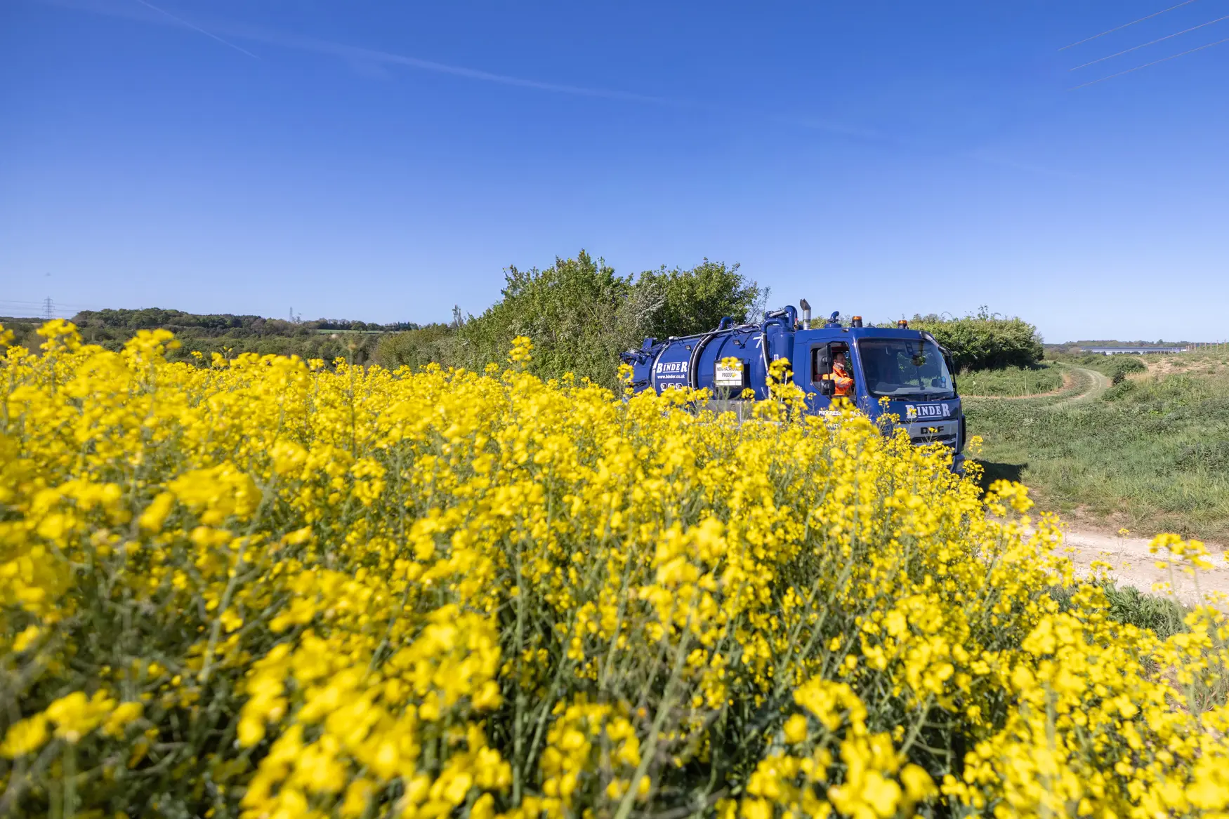 Tanker in an oil rapeseed field