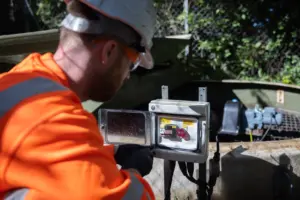 Team member checking electrical system of treatment plant