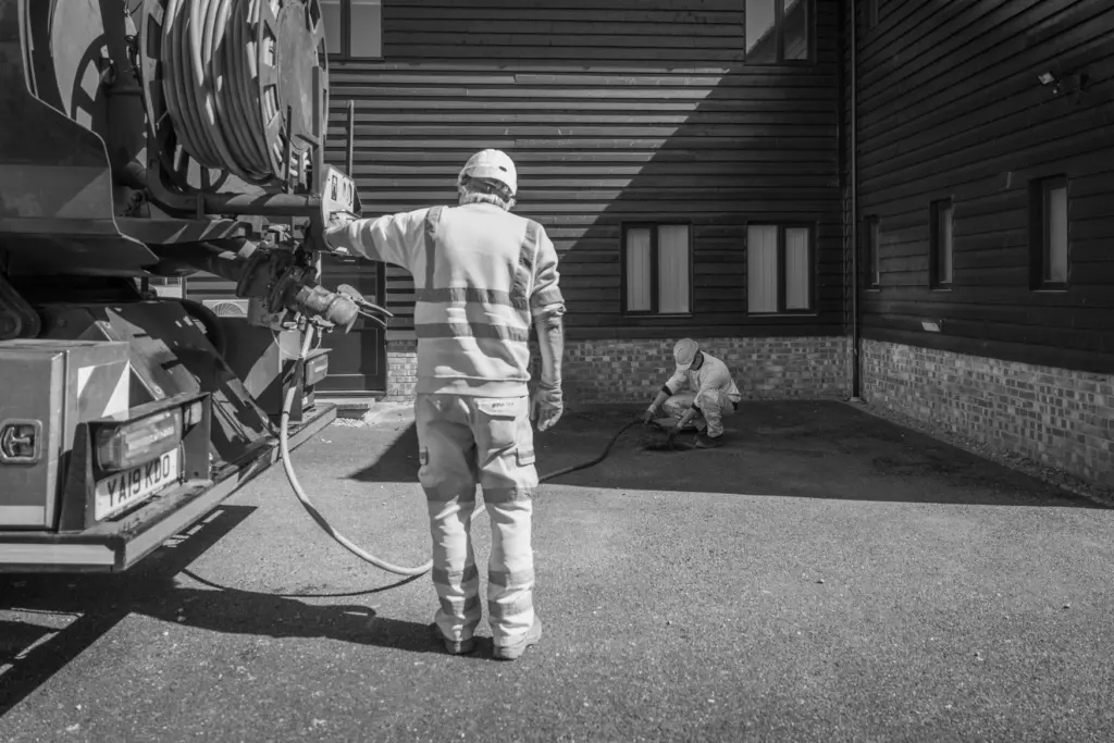 Black and white photo of jetting system in drain